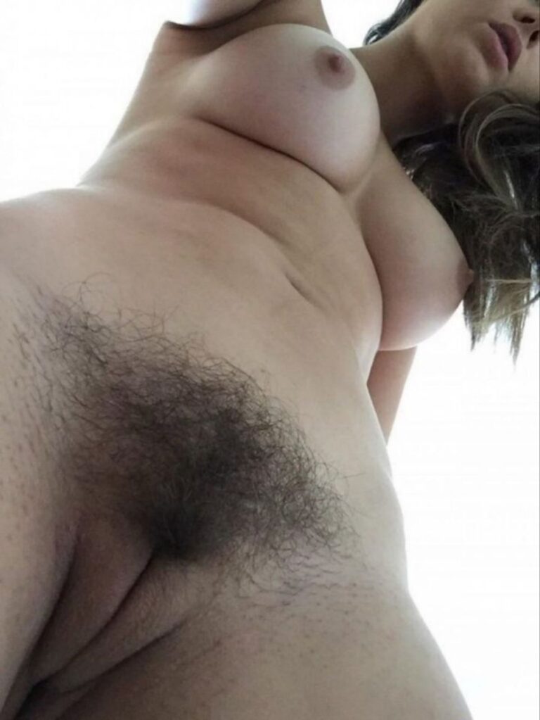 Woman showing her hairy pussy