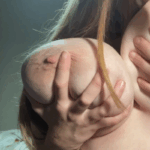 Quebecer plays with her very large boob