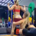 blondes pranking each other in the gym by taking off their shorts
